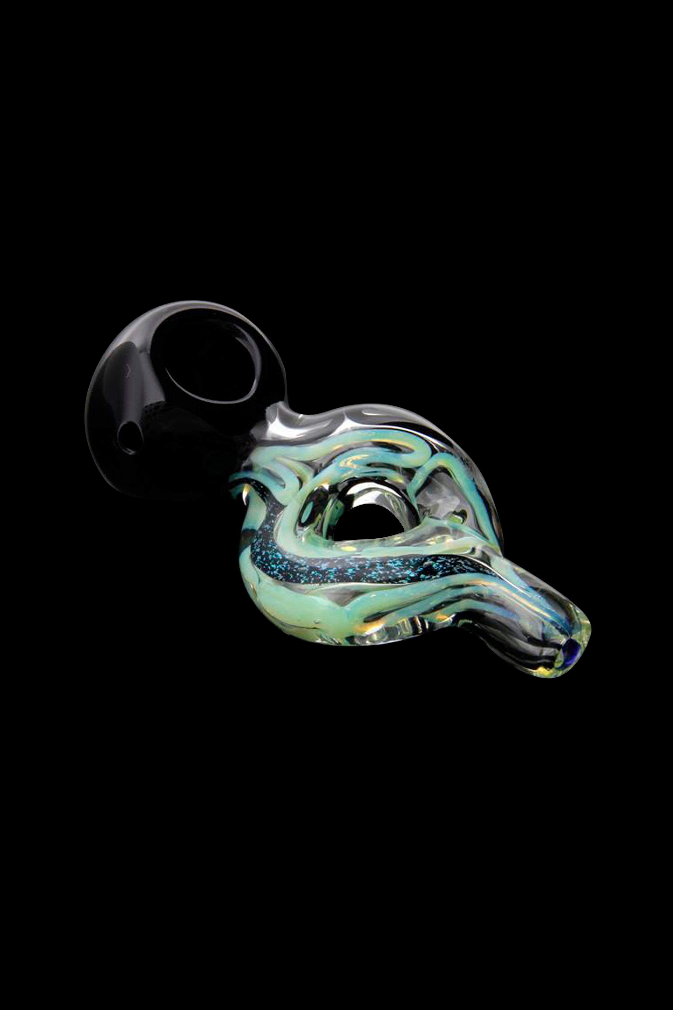 Hand-blown glass oil rig with iridescent green and blue swirls, isolated on black.