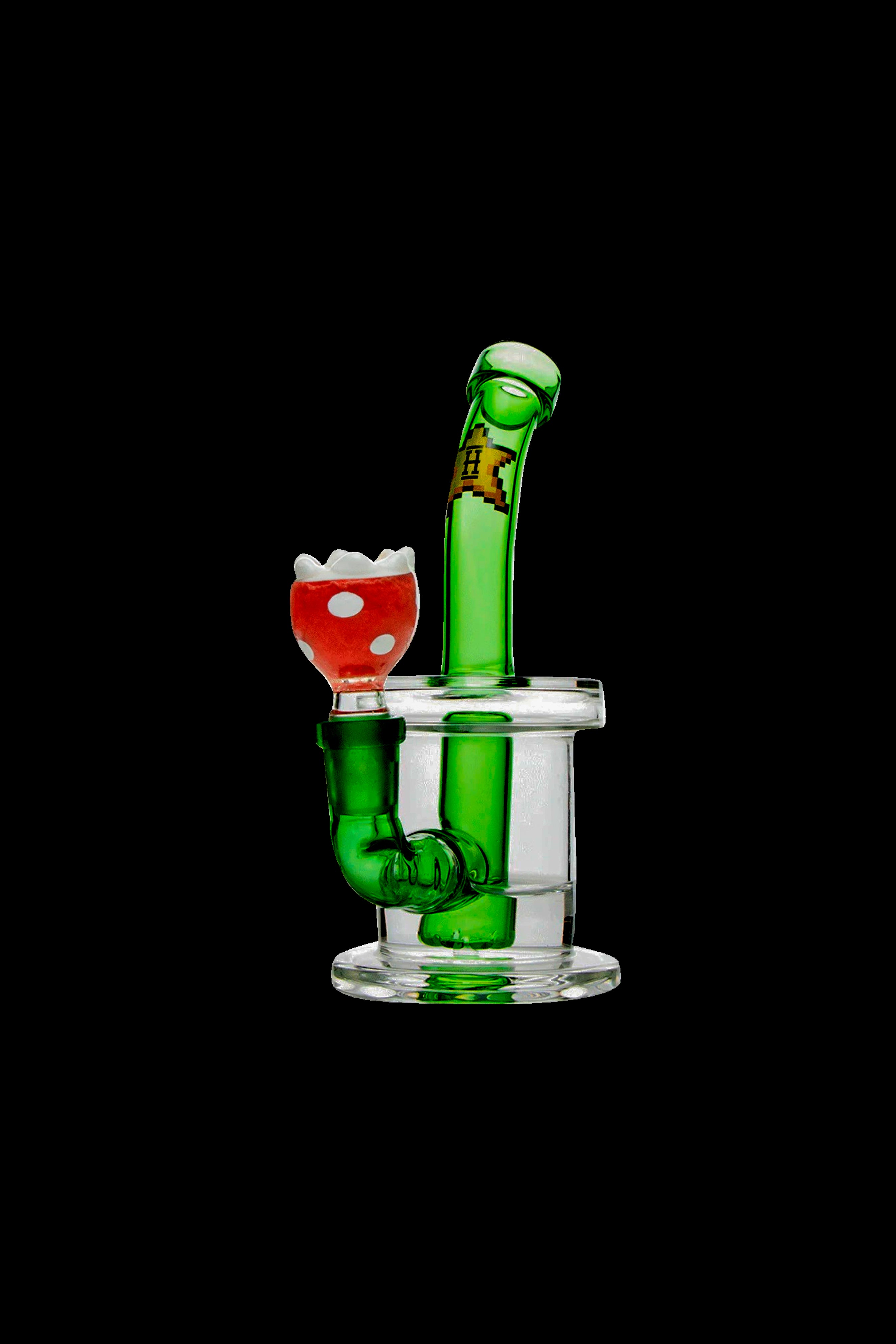 Green glass water pipe shaped like a retro video game character with a red flower-shaped bowl, isolated on a black background.