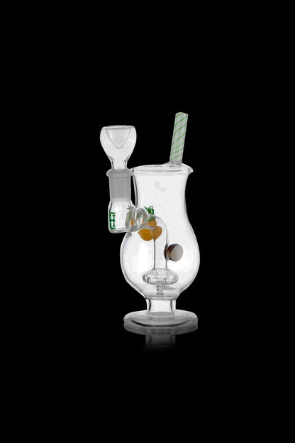 Clear glass bubbler water pipe with green accents and visible cannabis buds inside.
