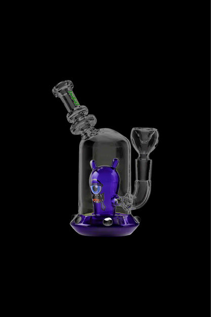 Purple glass water pipe with an alien-shaped perc inside, against a black background.