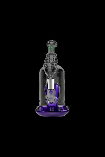 Glass dab rig with purple accents, isolated on a black background.