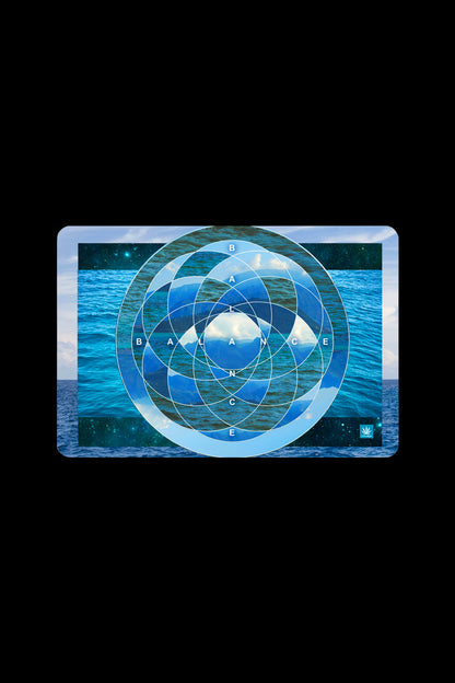 A rectangular cannabis rolling tray featuring an oceanic scene with concentric blue and white target-like circles and the word “BALANCE” spelled out within the design.