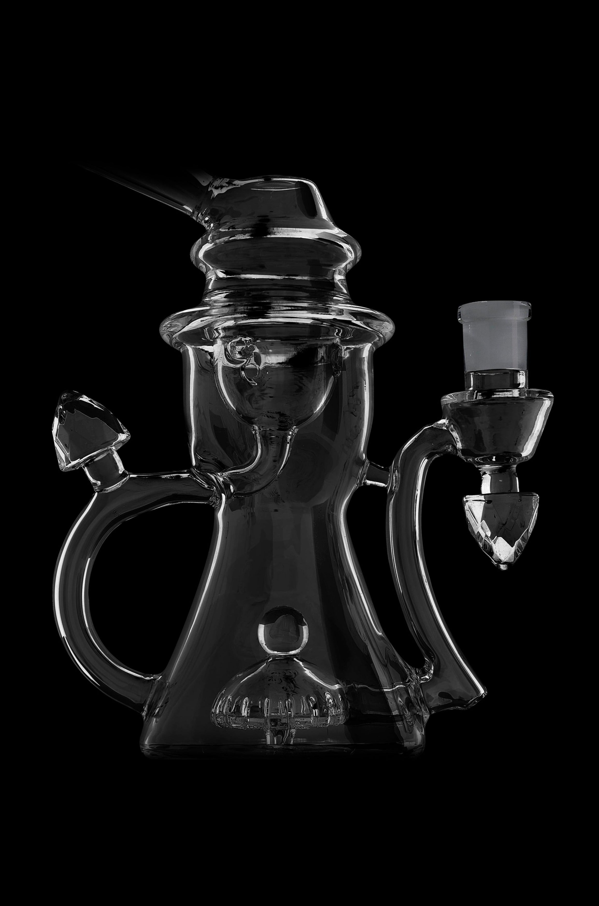 Black glass water pipe with intricate looping design and removable downstem.