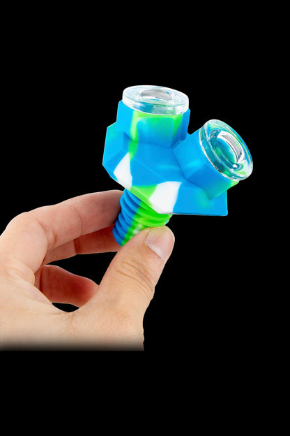 Blue silicone cannabis oil rig bubbler held in a hand.