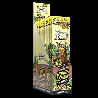 Angled front view of a yellow display of Blazy Susan Tea Leaf Cones showing stacked resealable pouches with honey‑lemon graphics.
