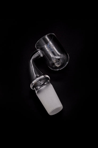 Clear glass dab rig attachment with a joint for connecting to a water pipe, isolated on a black background.