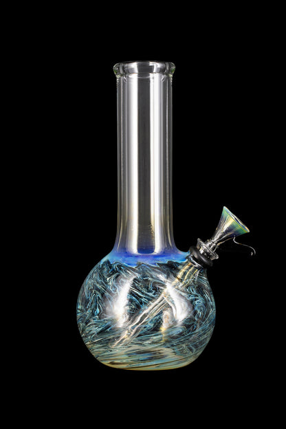 Glass water pipe with blue and green swirling patterns against a black background.