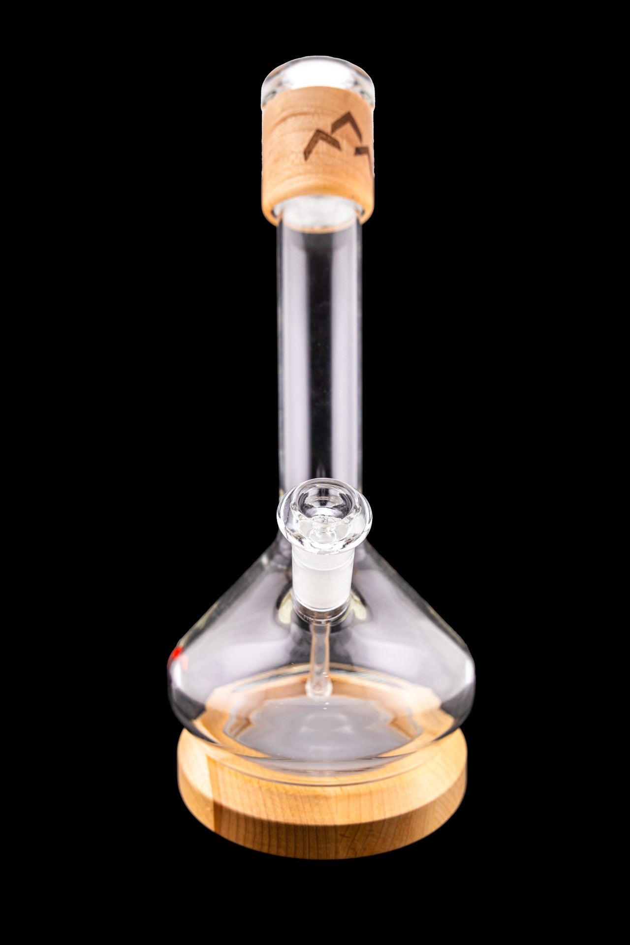 Glass water pipe with wooden accents, isolated on black.