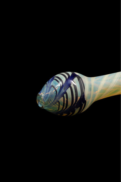 Close-up of a colorful glass pipe against a black background.