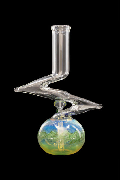 Clear glass water pipe with colorful, swirling patterns in the base.