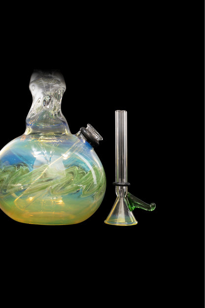 Glass water pipe and downstem with swirling blue and green patterns, isolated on a black background.
