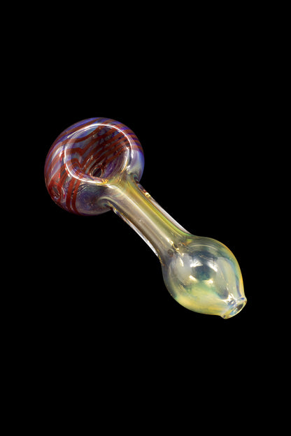 Glass pipe with red and blue swirls in the bowl, against a black background.