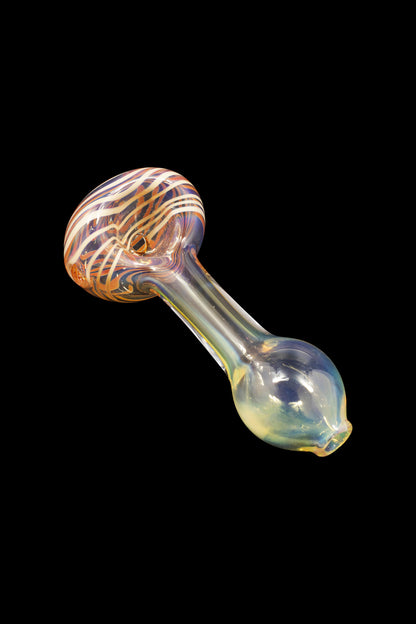 Hand pipe with colorful glass swirls and iridescent stem against a black background.