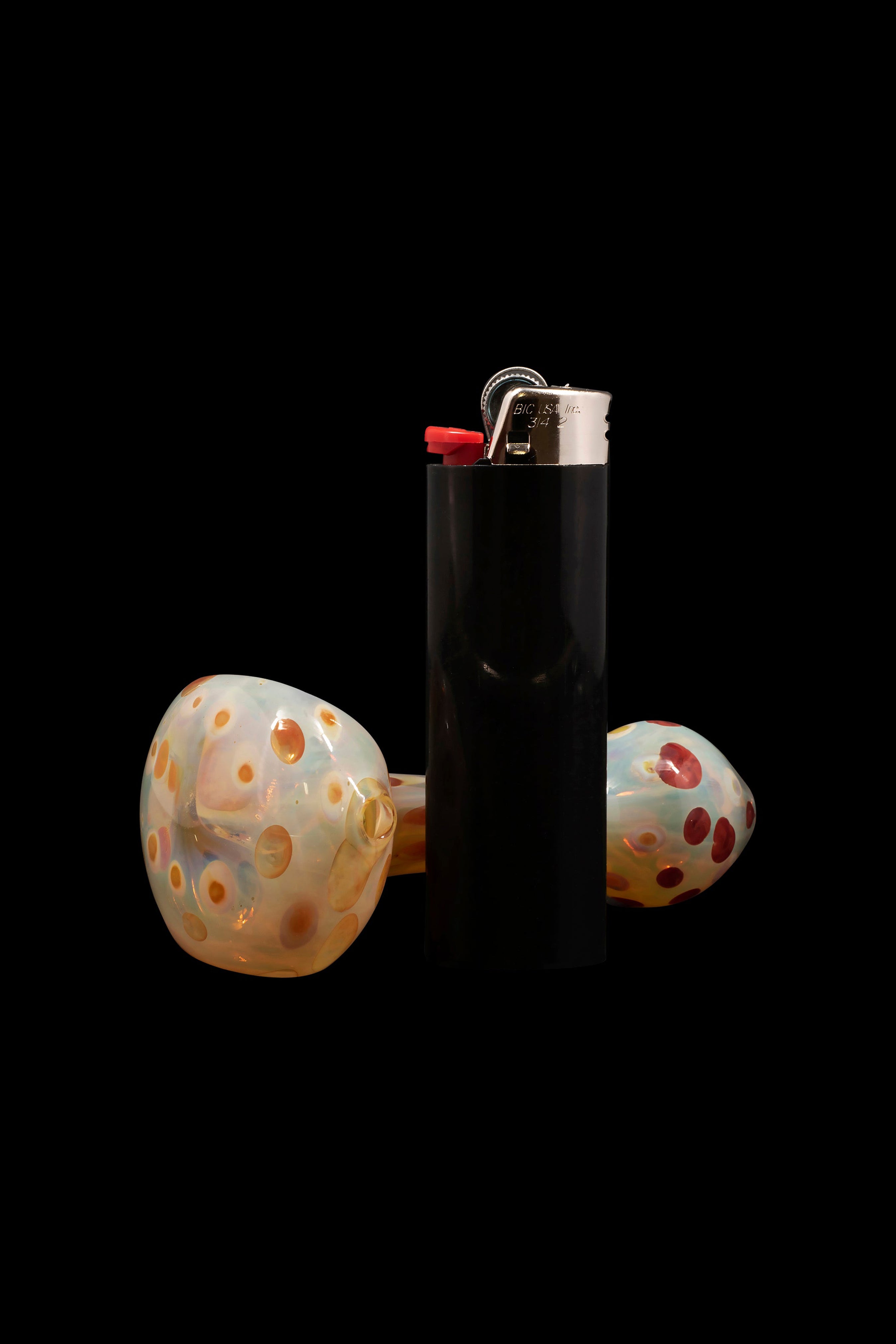 Glass cannabis pipe with a lighter.