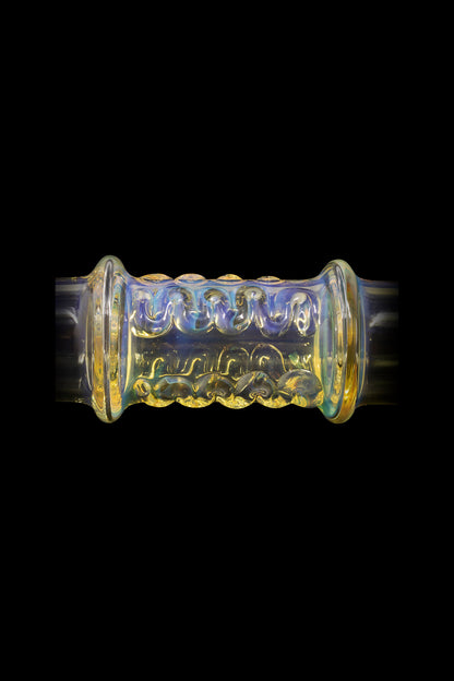 Hand-blown glass cannabis pipe with intricate floral carvings and iridescent coloring.
