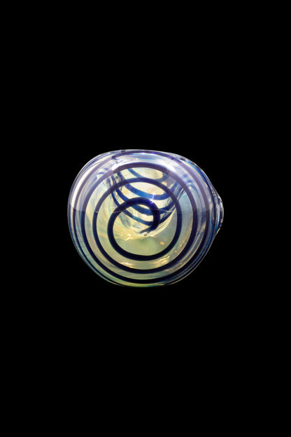 Hand-blown glass cannabis bowl with intricate blue and green swirling patterns.