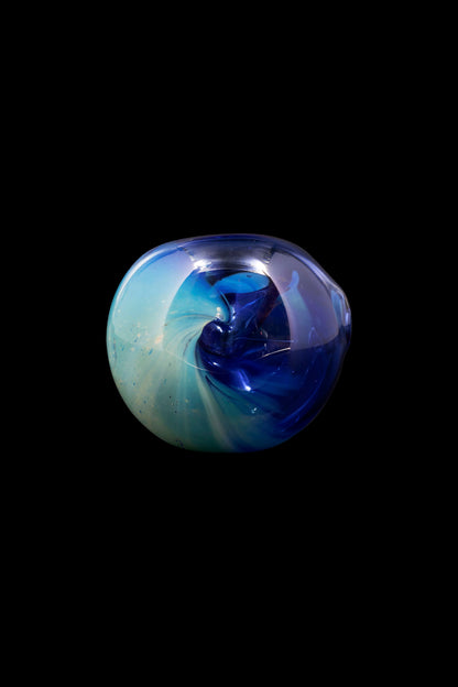 Swirling blue and green glass orb, likely a cannabis smoking accessory.