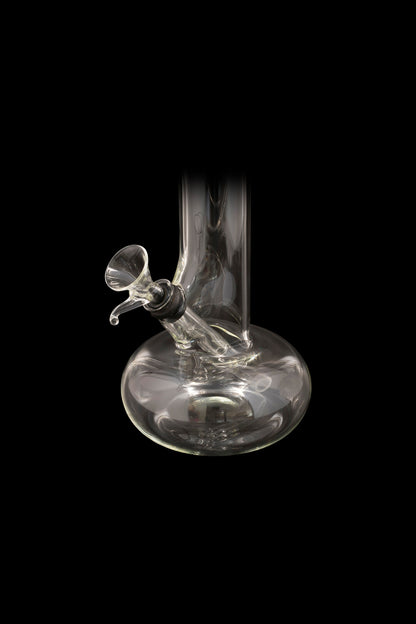 Clear glass water pipe (bong) against a black background.