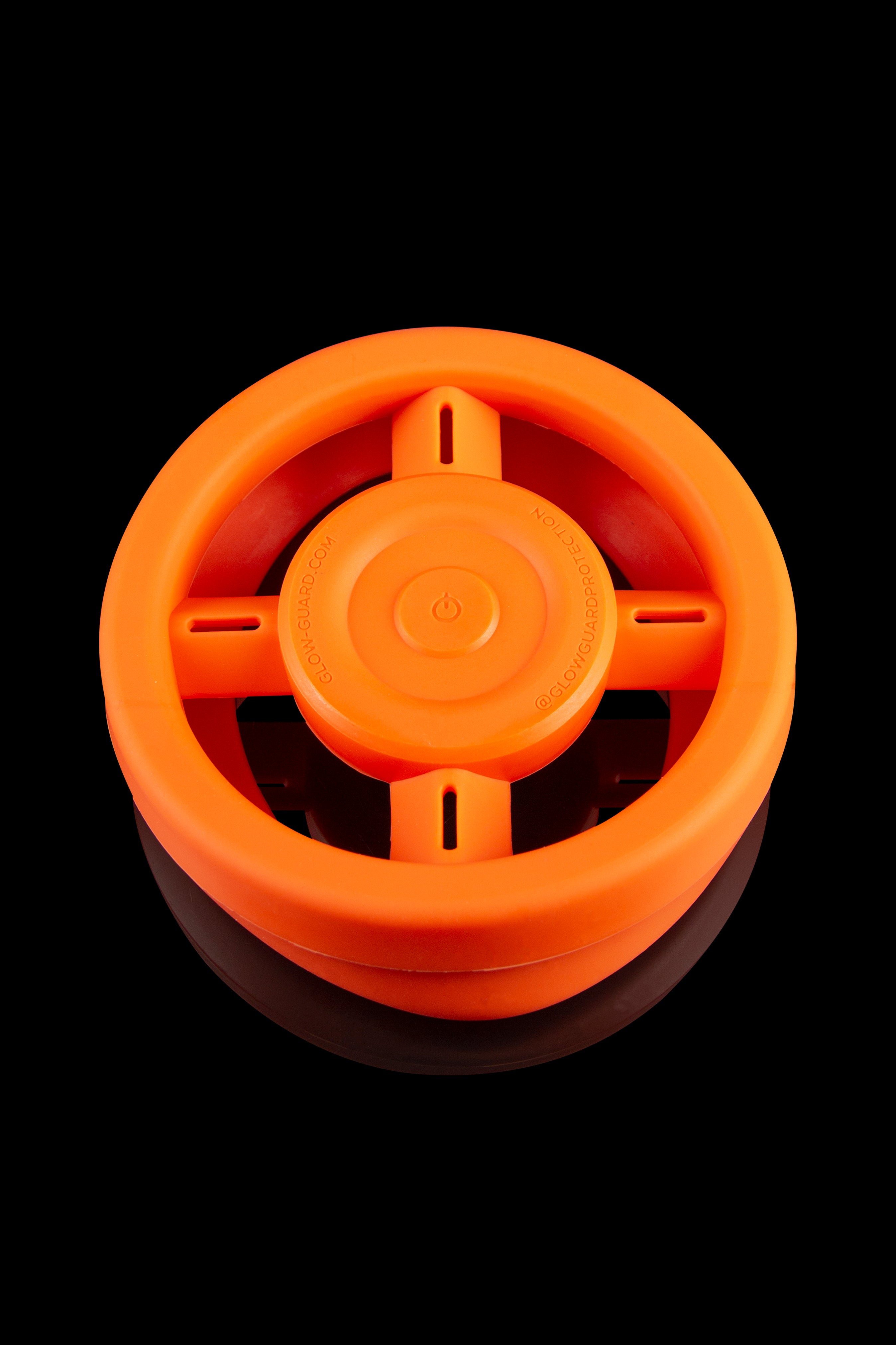 Orange silicone container for cannabis storage, top view.