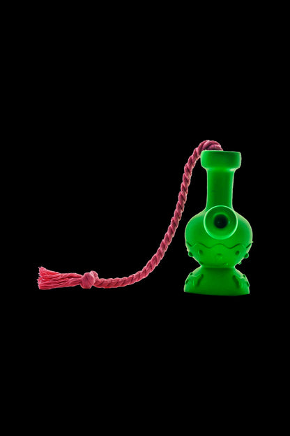 Green glass bubbler with a red cord attached.