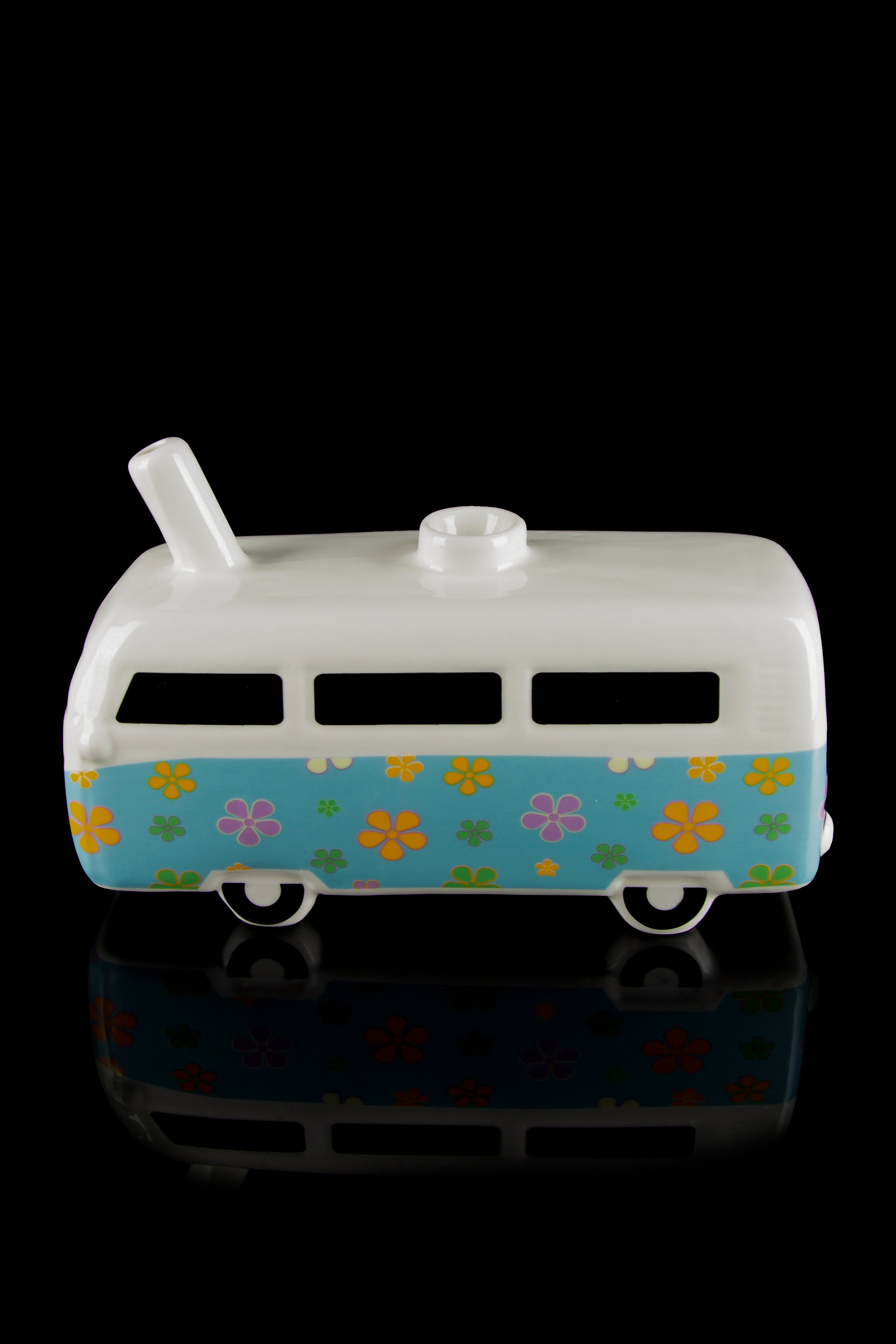 Retro-style ceramic van, decorated with colorful floral patterns, likely used as a discreet cannabis storage container.