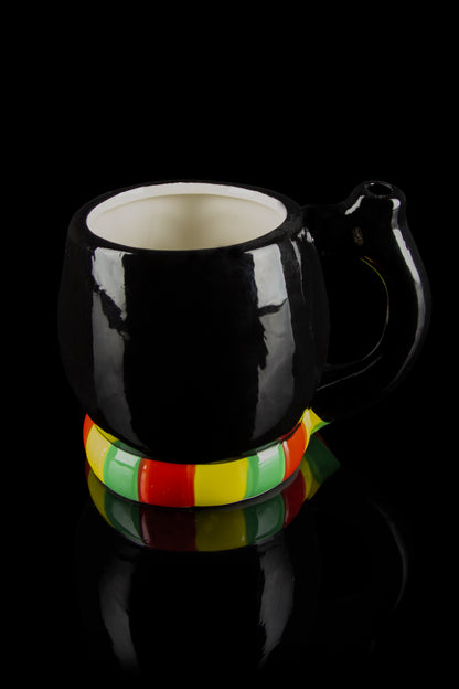 Black ceramic water pipe with Rastafarian-colored band, studio shot.
