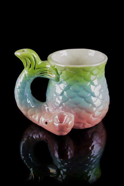 A colorful, sculpted glass water pipe shaped like a dragon’s head with a smooth, reflective surface.