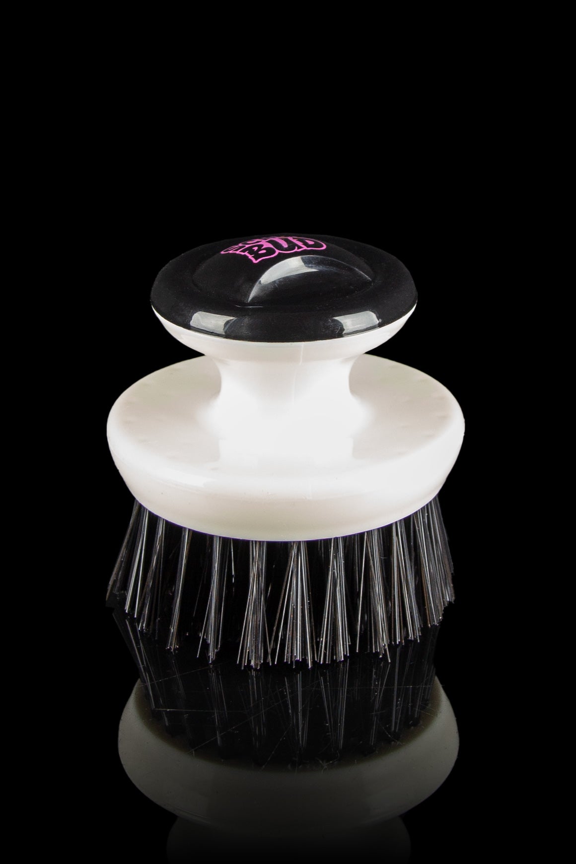 White and black resin brush with pink “BUD” logo, used for cleaning cannabis accessories.