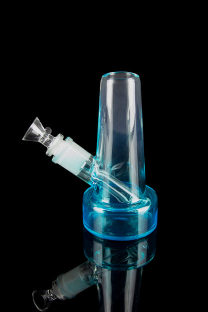 Blue glass bubbler water pipe with visible internal chamber and joint for a bowl, isolated on a black background.
