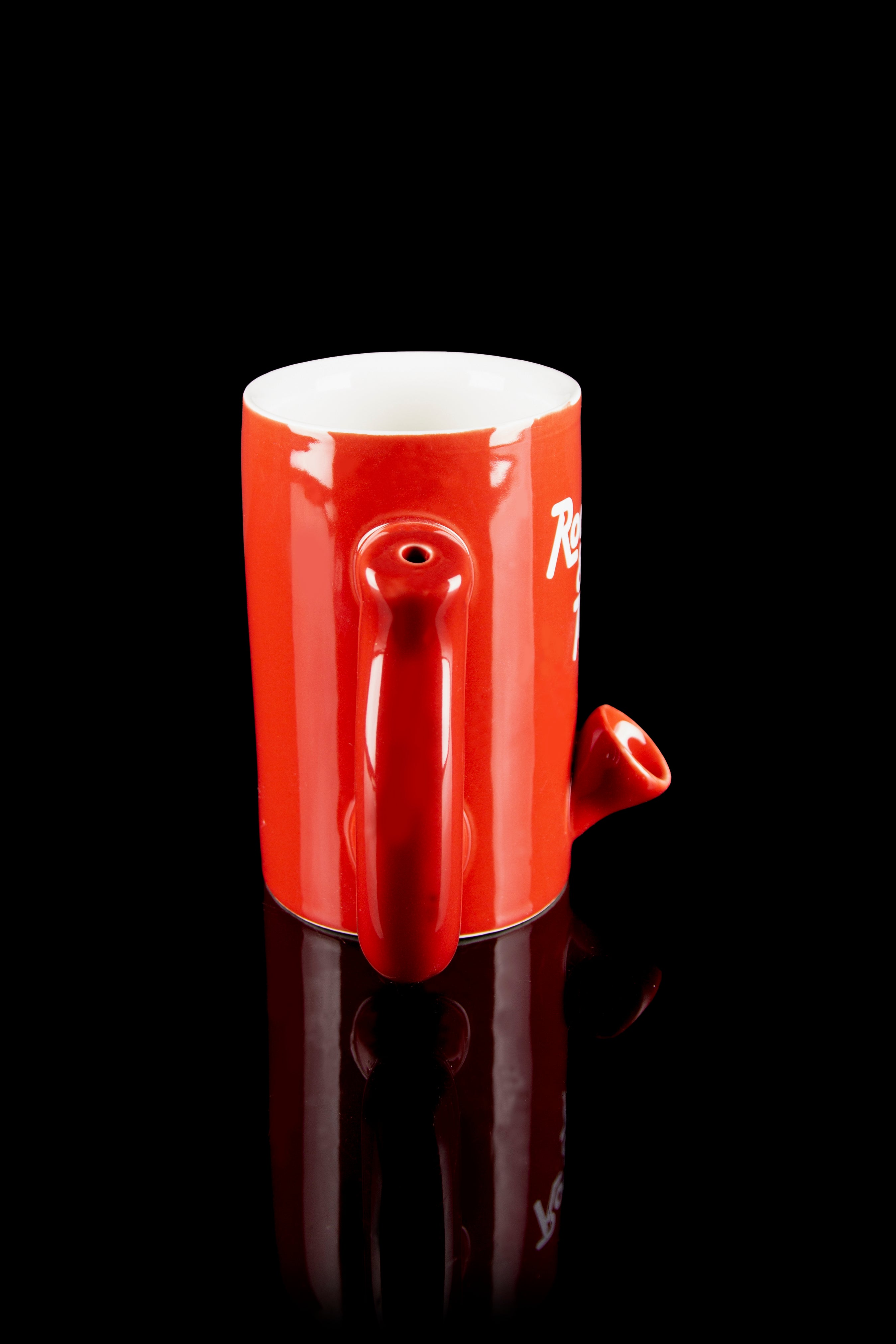 Red ceramic pipe shaped like a mug with a glossy reflective surface.