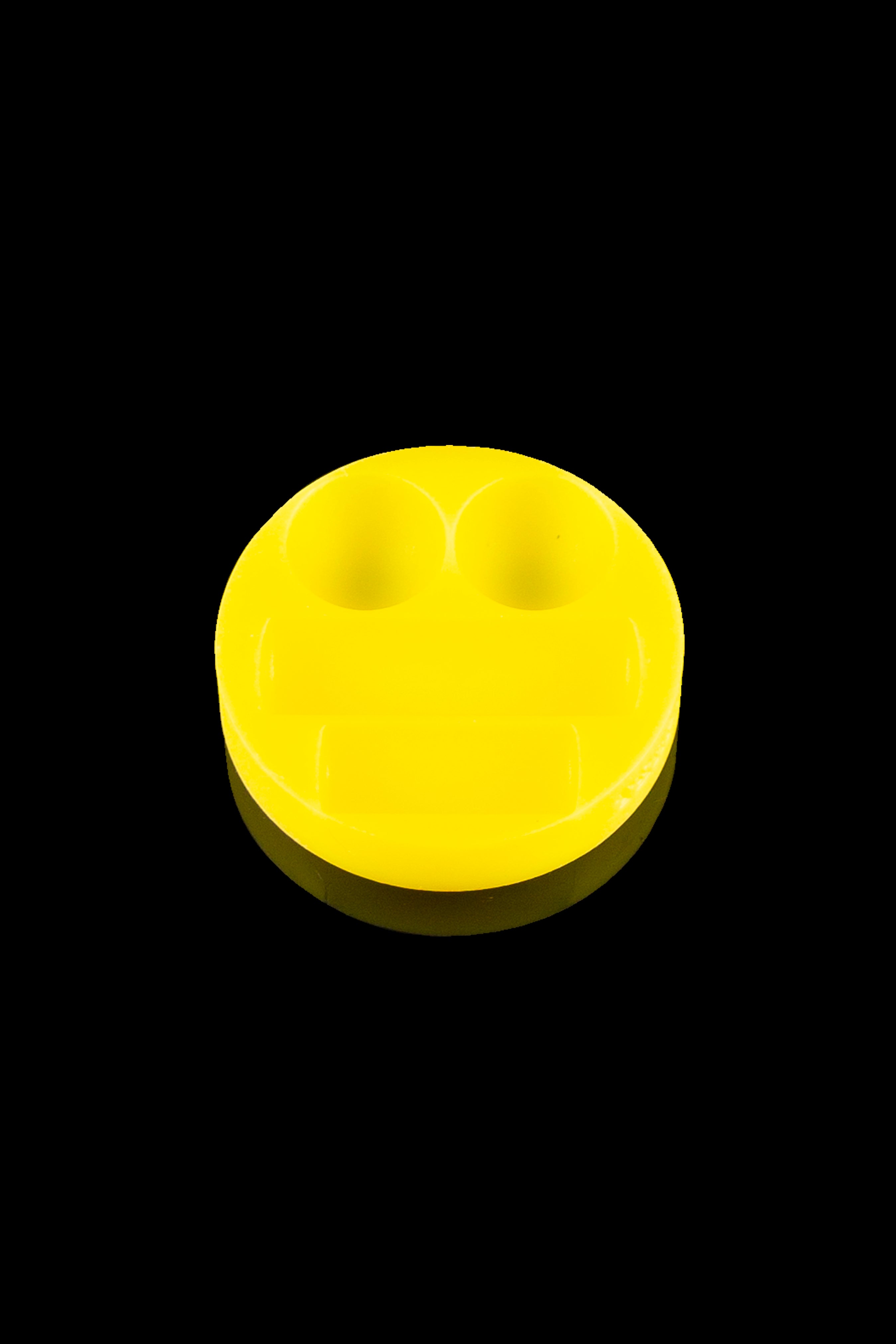 Yellow smiley face sticker or patch, likely for cannabis accessories.