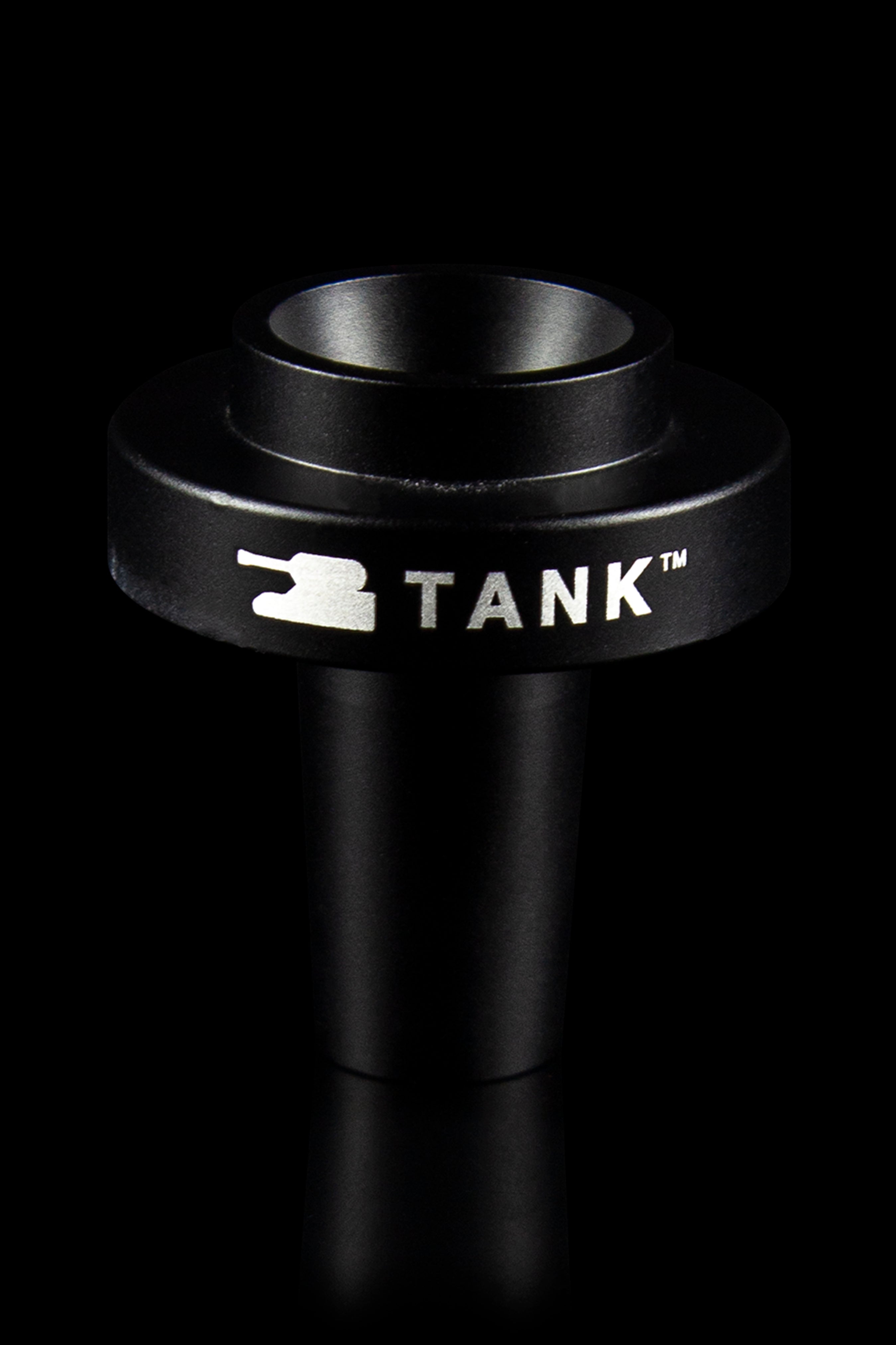 Black cannabis oil vape cartridge with “TANK™” branding, studio shot."