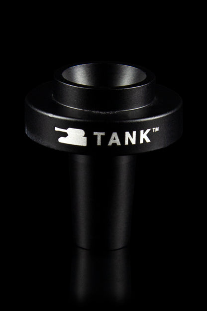 Black cannabis oil vape cartridge with “TANK™” branding, studio shot."
