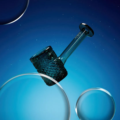 Angled close-up of the teal textured bowl and straight neck of the Jane West Twenties Collection Hand Pipe against a deep blue, bubble-speckled background
