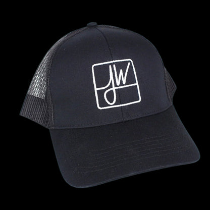 Black trucker hat with a white square logo featuring stylized cannabis leaves.