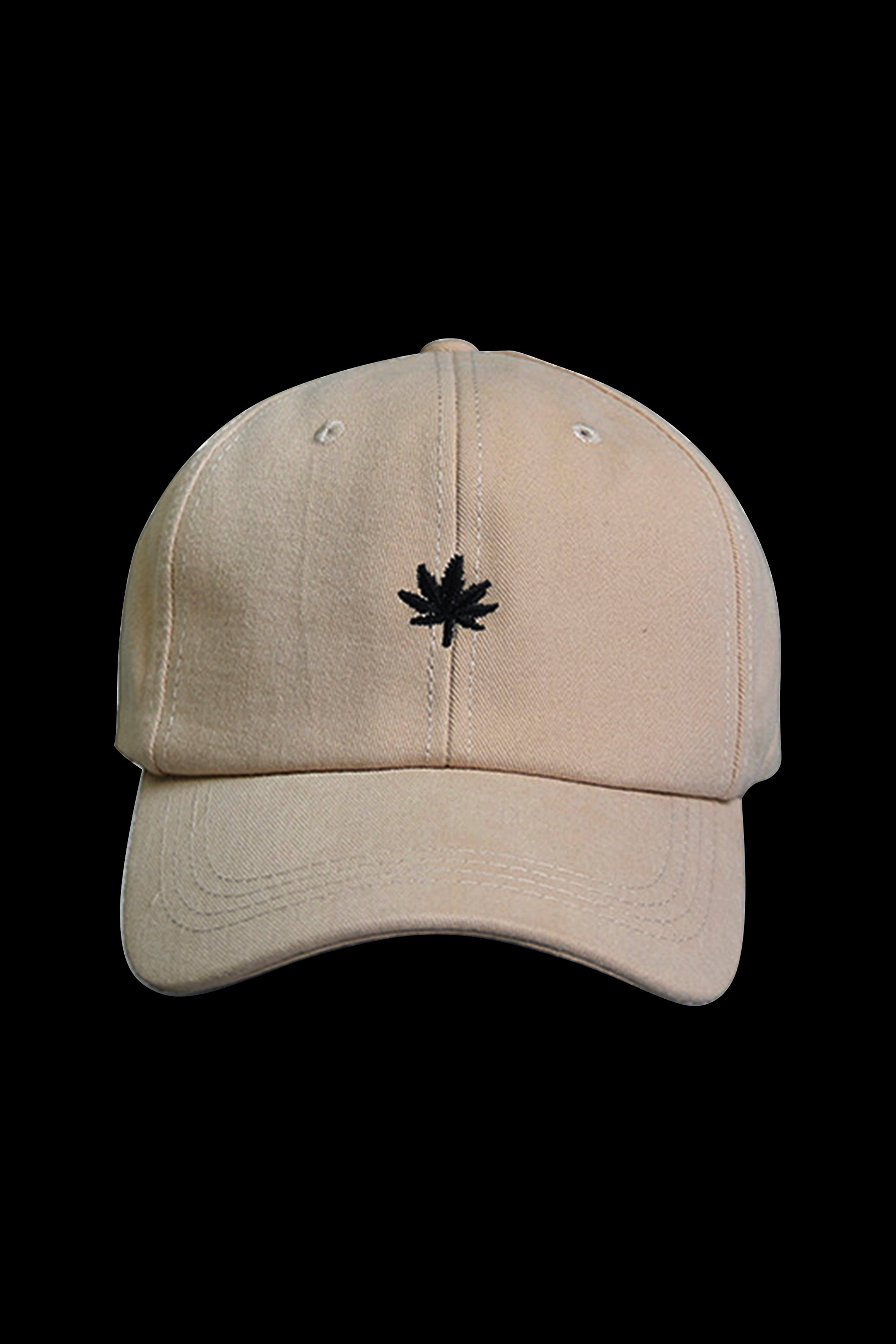 Tan baseball cap with a small, embroidered cannabis leaf on the front.