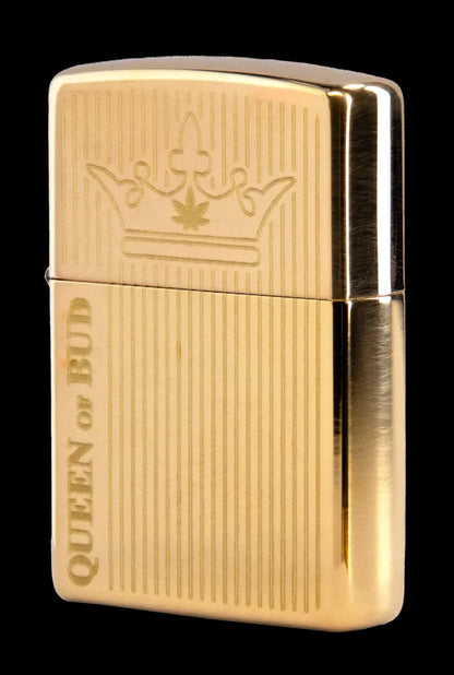 Gold Zippo-style lighter engraved with a crown and cannabis leaf above the text “QUEEN OF BUD.”