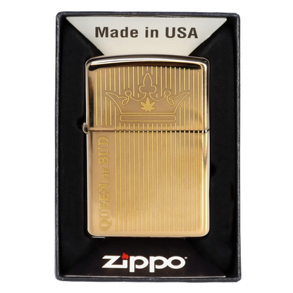 Gold Zippo lighter with a cannabis leaf crown design and “Queen of Bud” engraving, presented in a black box.