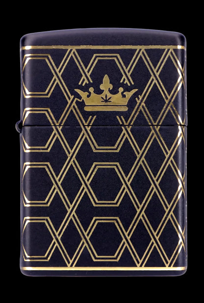 Black Zippo-style lighter with a gold geometric pattern and a cannabis leaf within a crown at the top.