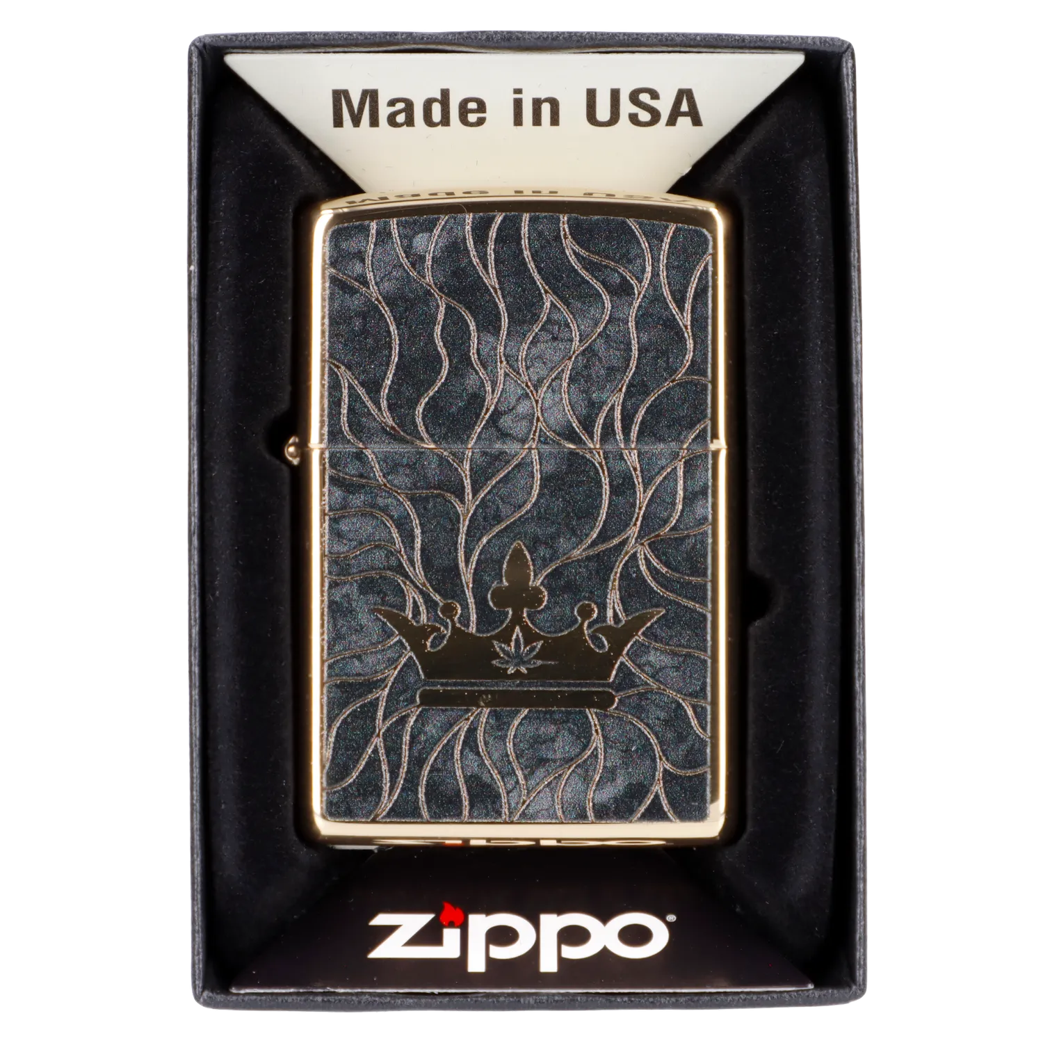 Zippo lighter with a black and gold cannabis leaf design in its packaging.