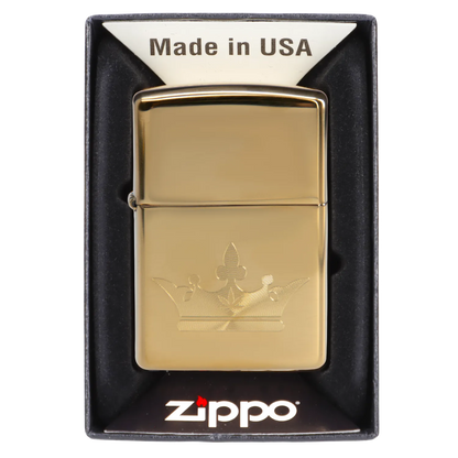 Gold Zippo lighter engraved with a cannabis leaf design in its packaging.