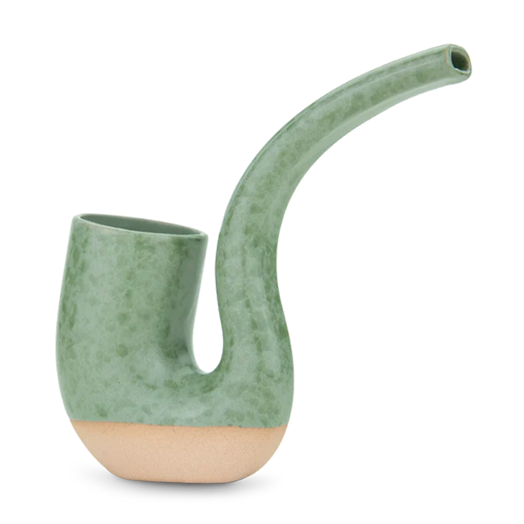 Angled side view of the green ceramic Puffco Proxy Terrapipe with a speckled glaze and exposed unglazed base.