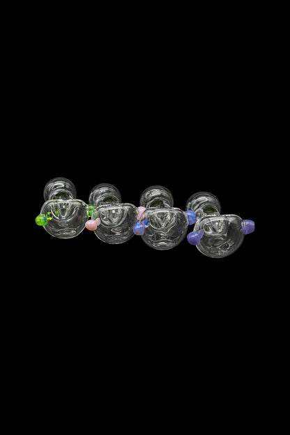 A row of colorful glass cannabis bubblers against a black background.