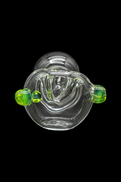 Clear glass cannabis bubbler with green accents, studio shot on black.