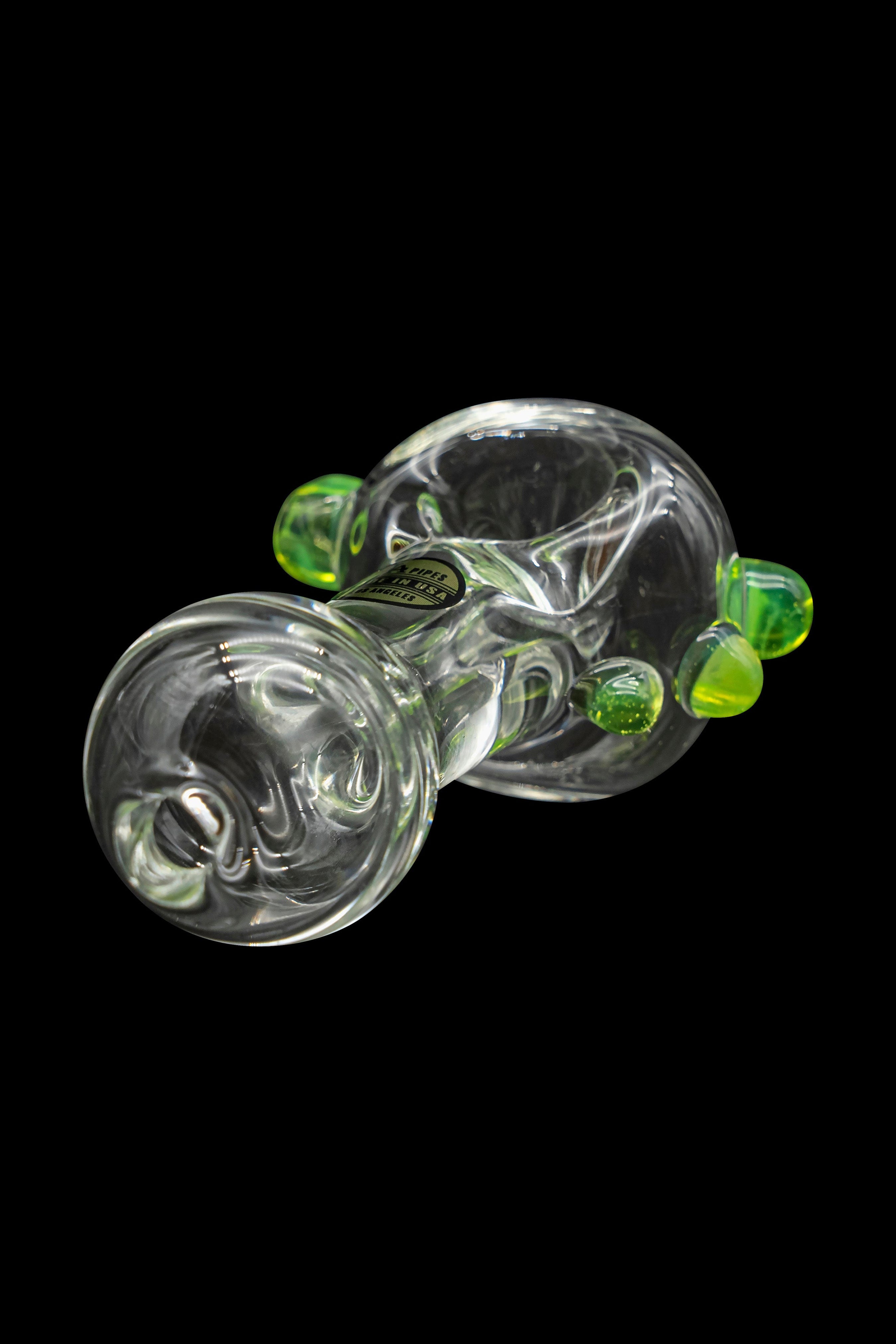 Green glass cannabis bubbler with swirling patterns and bubbles.