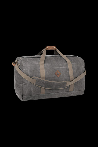 Wax canvas duffel bag with leather straps, designed for discreet cannabis accessory transport.