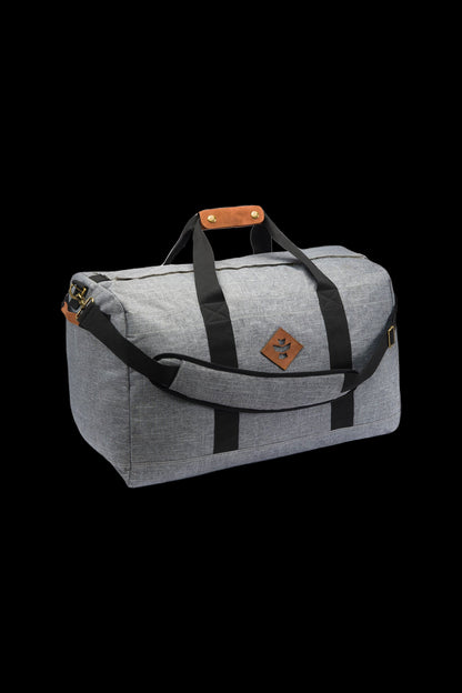 Gray cannabis accessory travel bag with leather handles and accents, displayed on a black background.