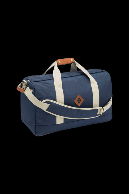 Navy blue and beige cannabis accessories duffel bag with a leaf-shaped logo.