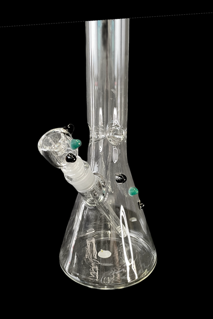 Clear glass water pipe (bong) with green and black accents, isolated on a black background.
