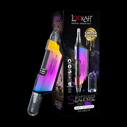 Angled close-up of a rainbow-finish Lookah Seahorse Pro Plus device leaning against its black limited-edition box, shown on a dark background.